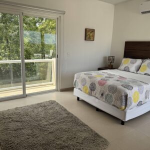 Rooftop Queen Bedroom with view of balcony